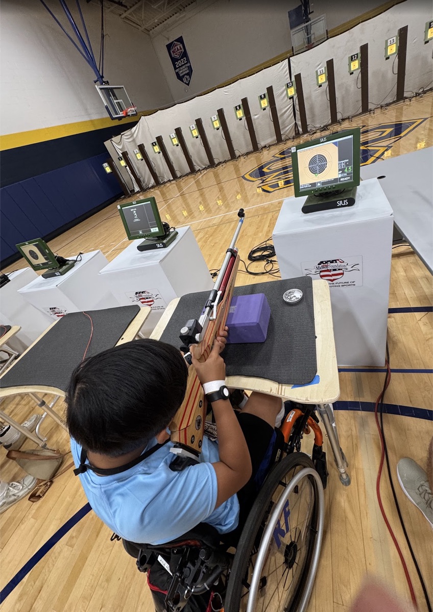 Ryle shooting air rifle from wheelchair