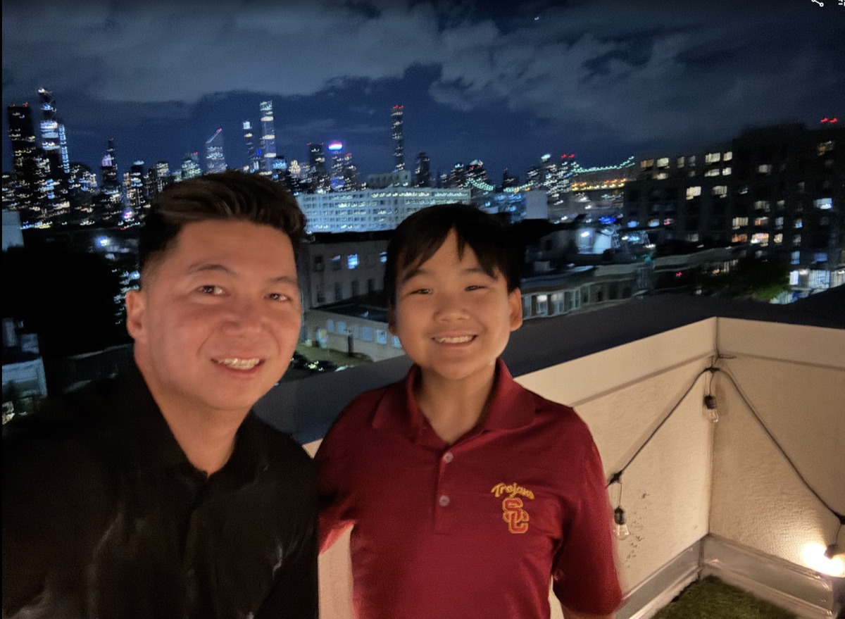 Ryle in USC shirt with city skyline